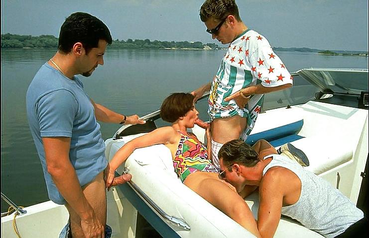 Lovely brunette getting fucked by three guys on a boat #7266131