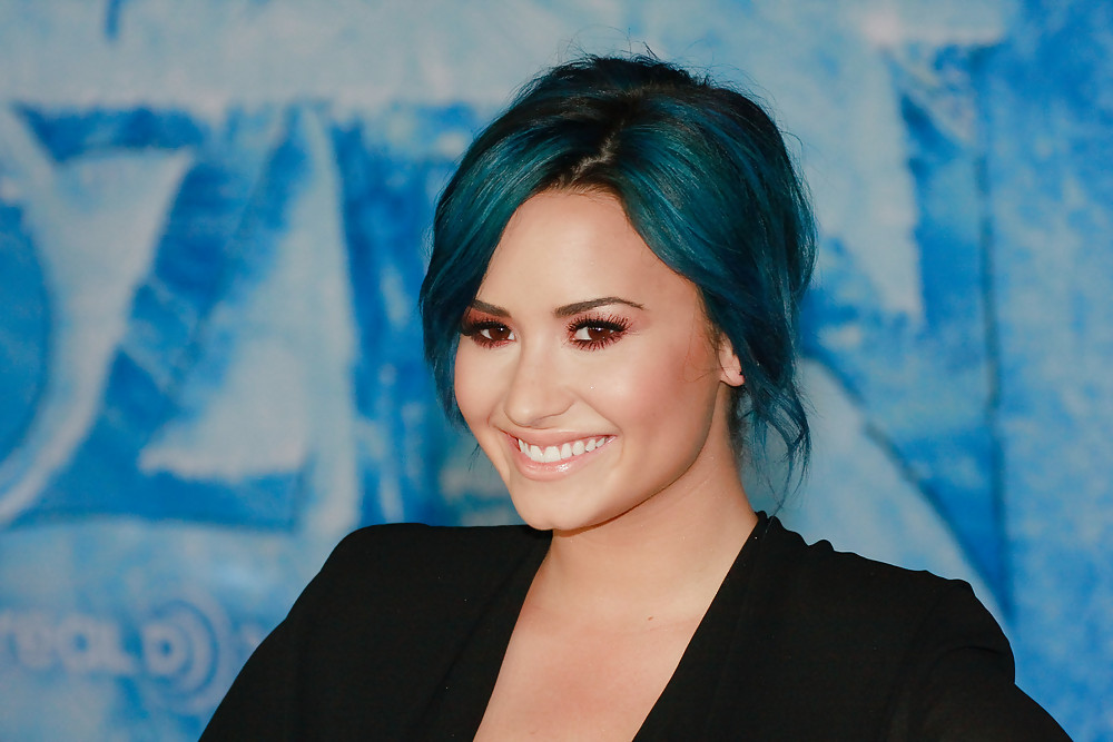 Demi Lovato with blue hair and business style #22179986