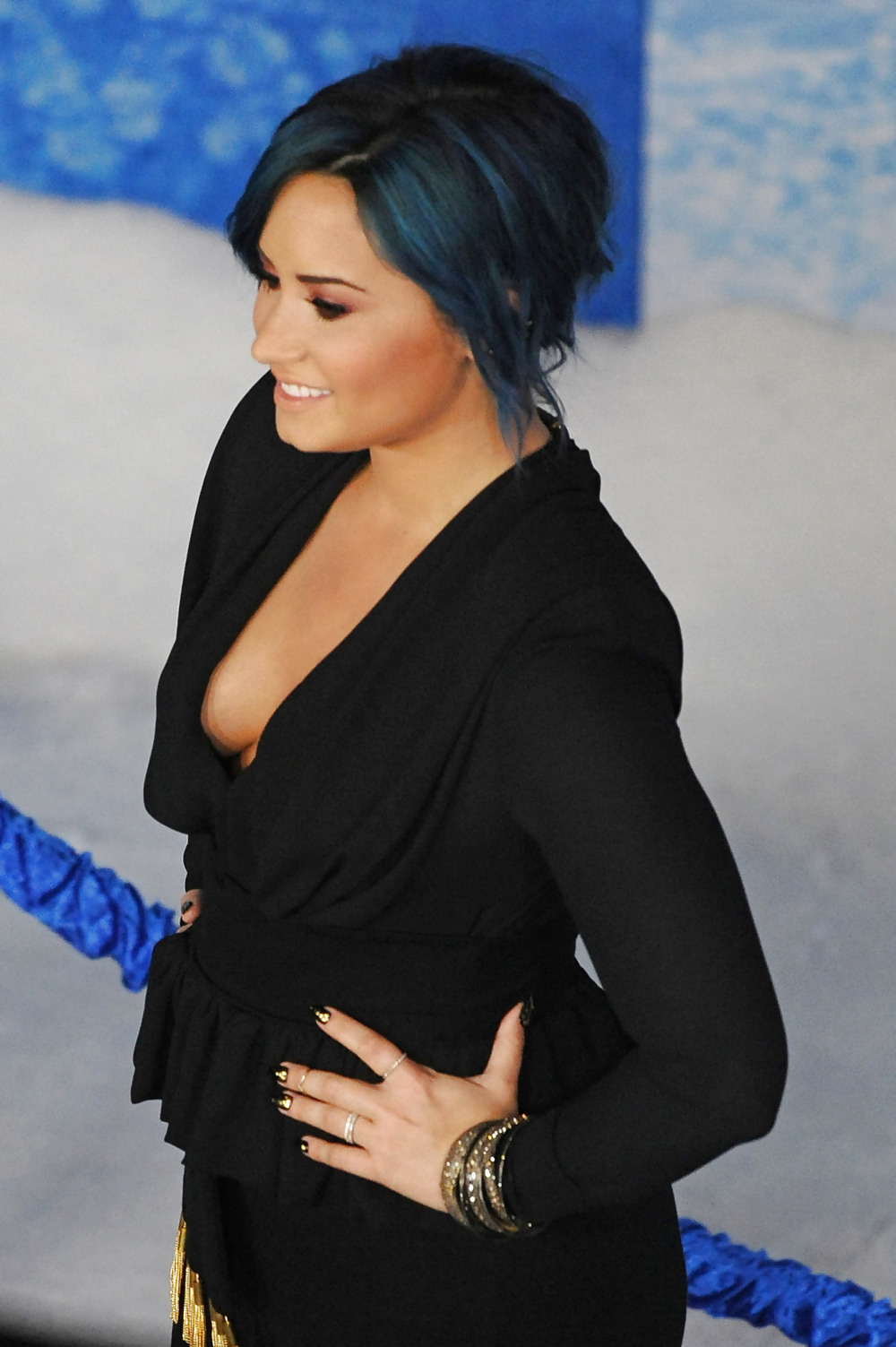 Demi Lovato with blue hair and business style #22180053