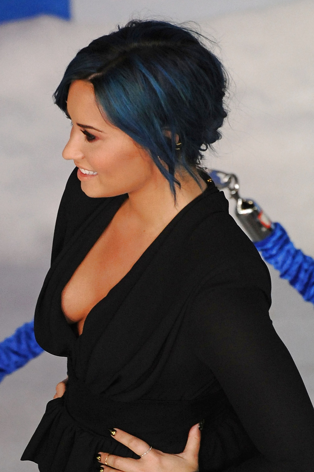 Demi Lovato with blue hair and business style #22180059