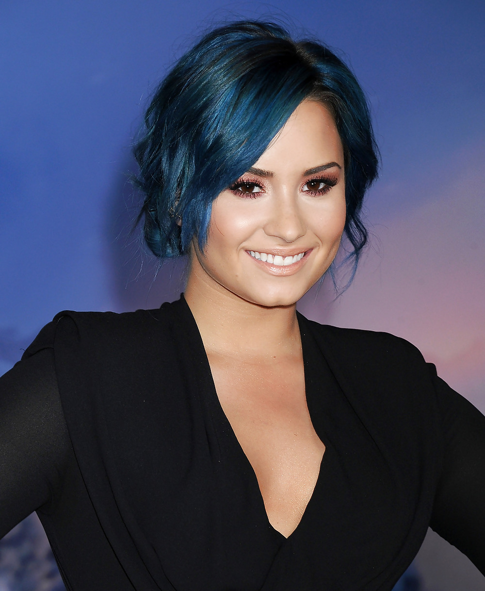 Demi Lovato with blue hair and business style #22180074