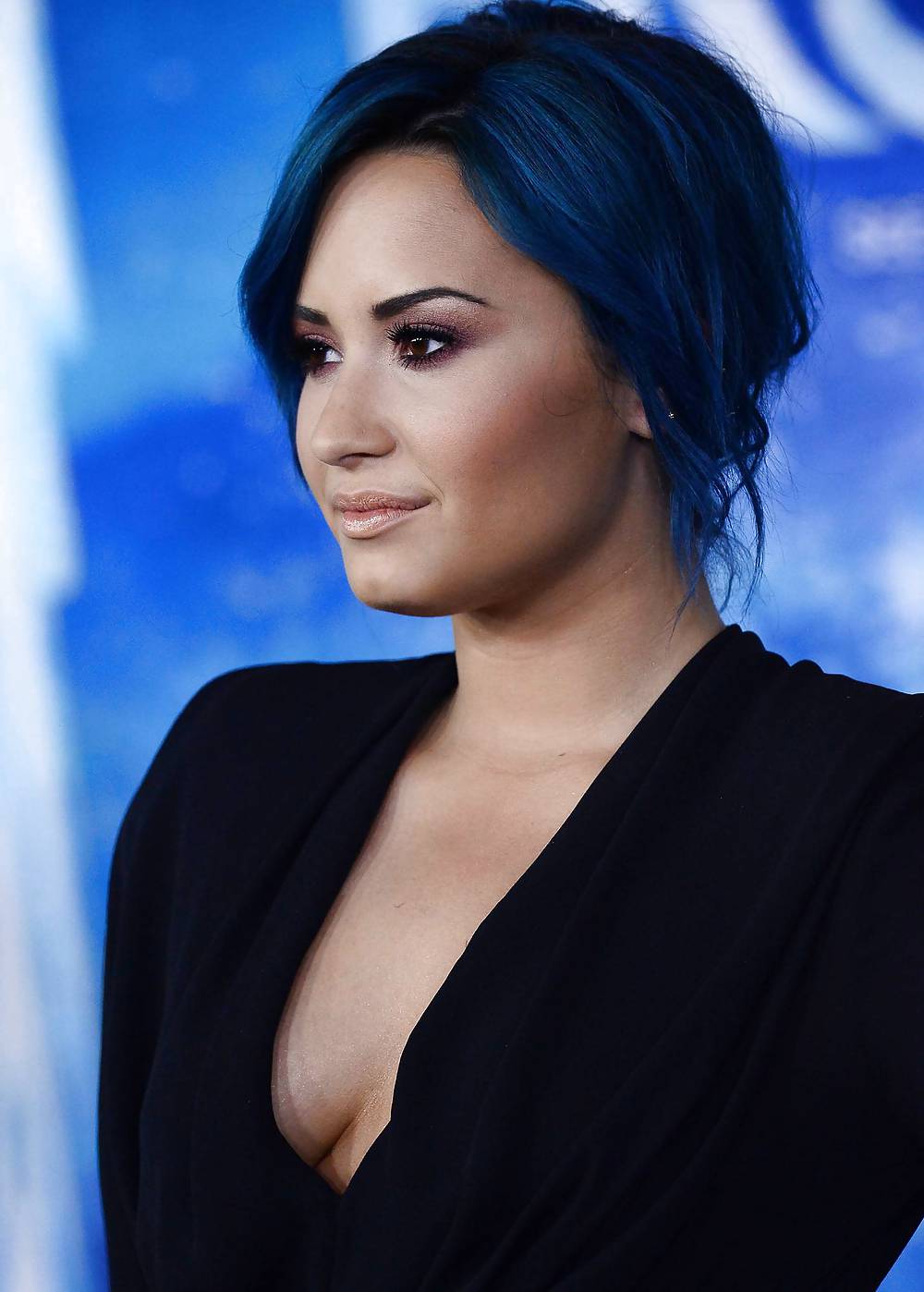 Demi Lovato with blue hair and business style #22180091