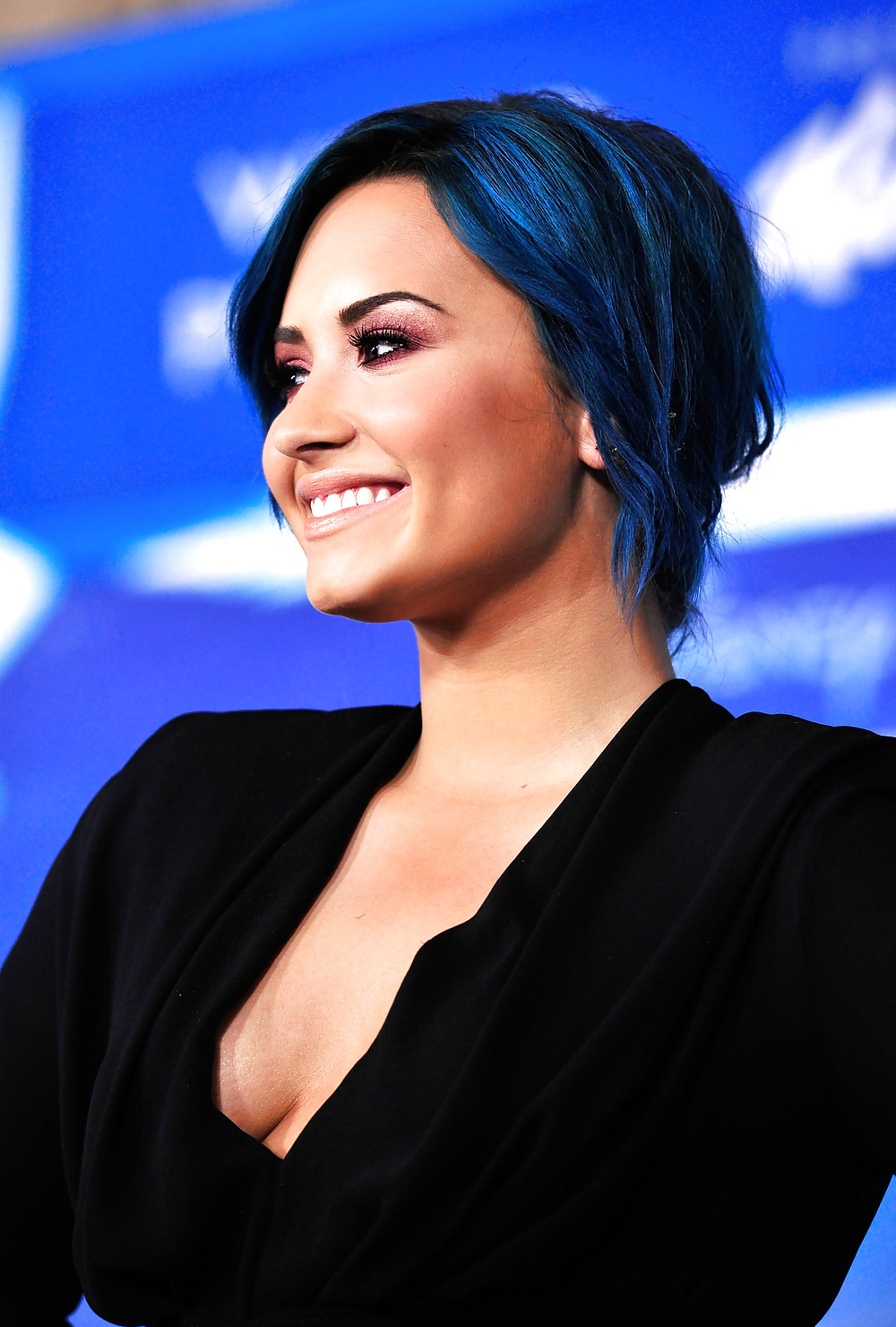 Demi Lovato with blue hair and business style #22180172
