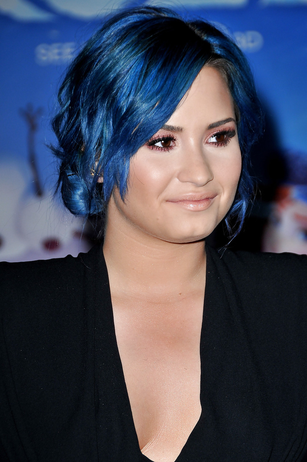 Demi Lovato with blue hair and business style #22180178