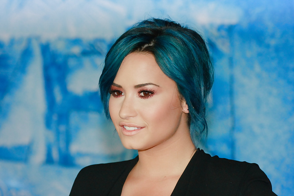 Demi Lovato with blue hair and business style #22180229