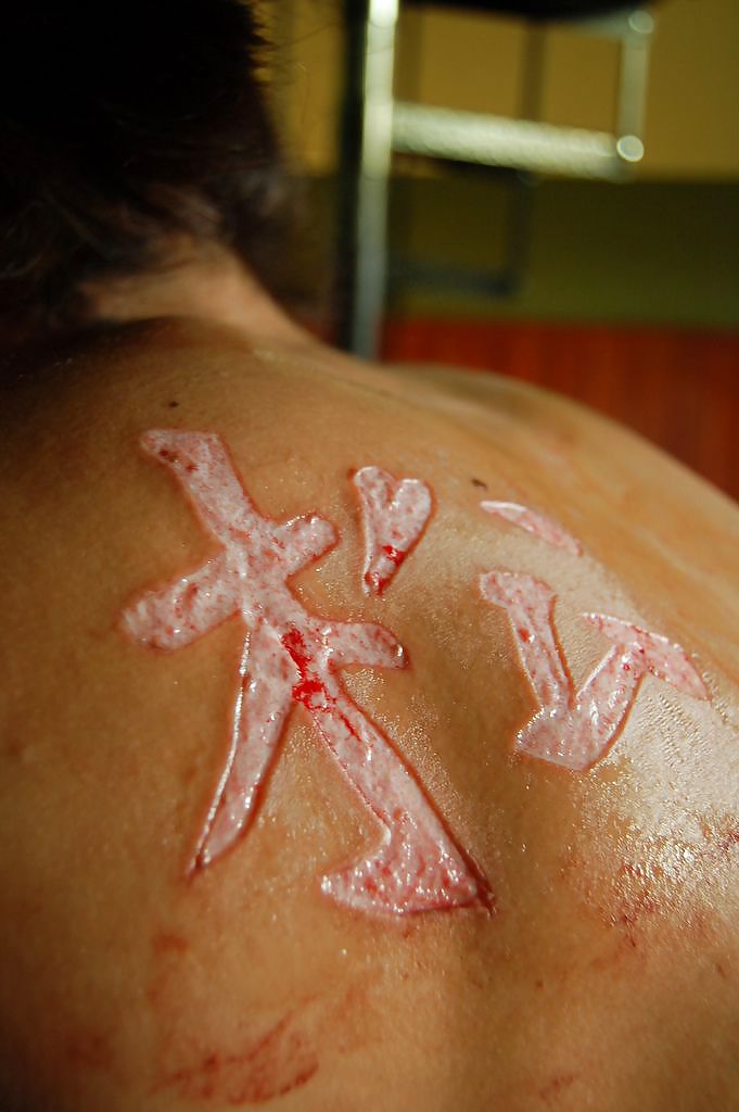 Scarification - teens most popular body modification #9454194