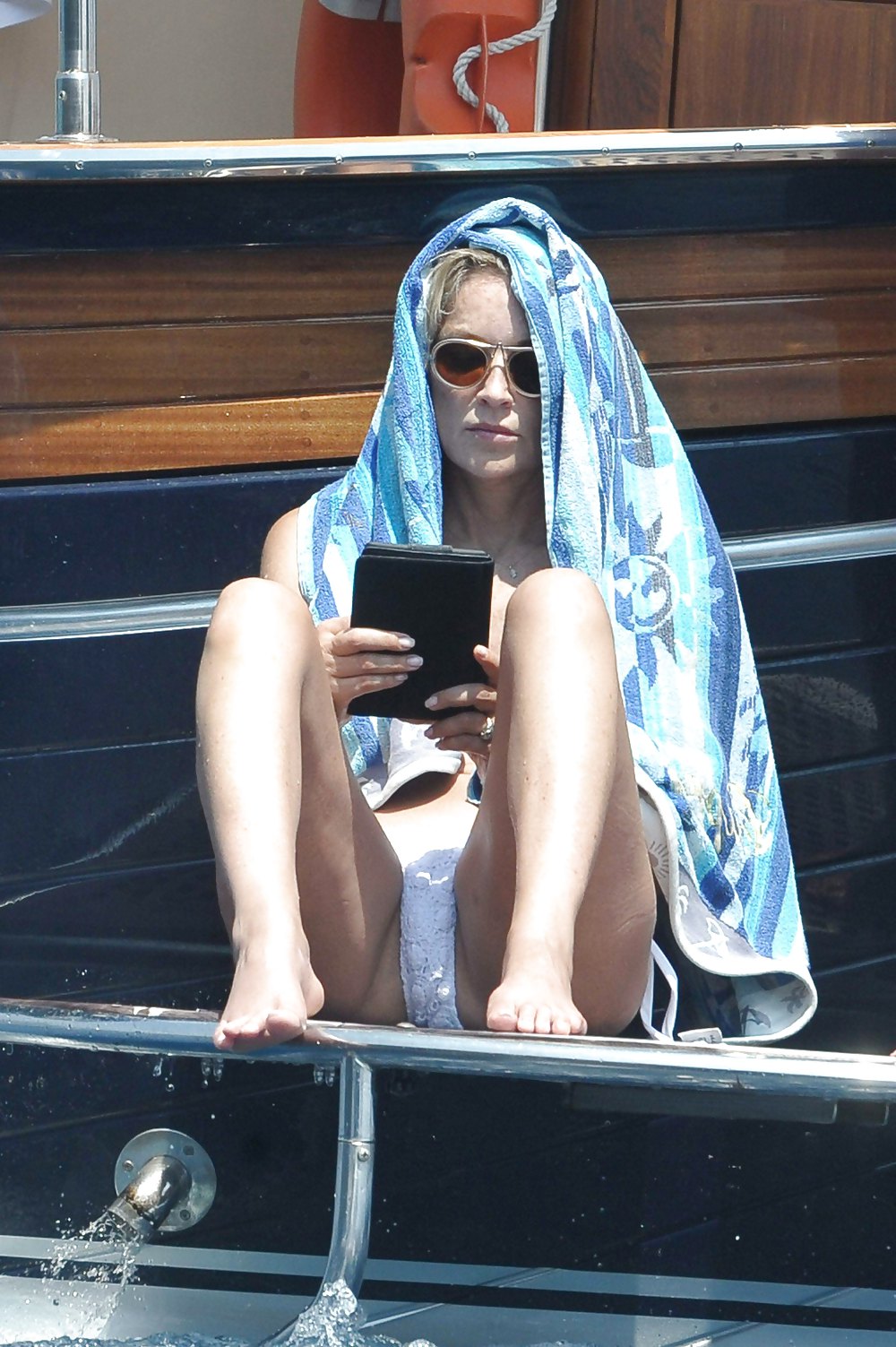 Sharon Stone - Spreading in Bikini (July 24, 2013) #21065570