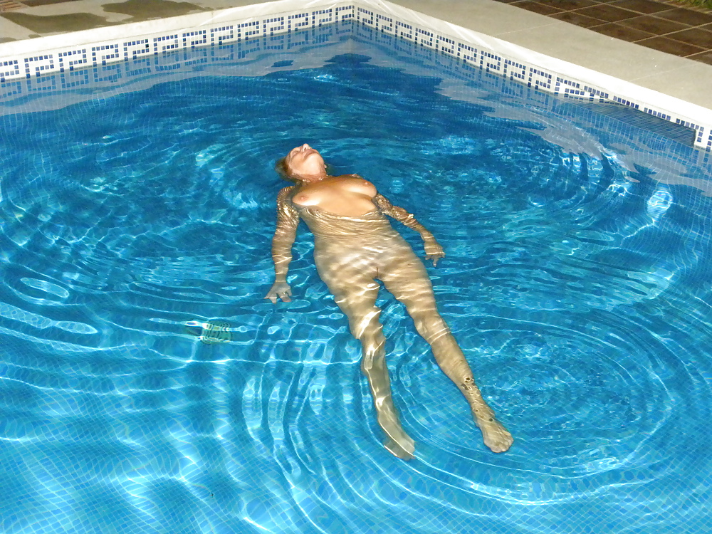 Floating in the pool #19015742