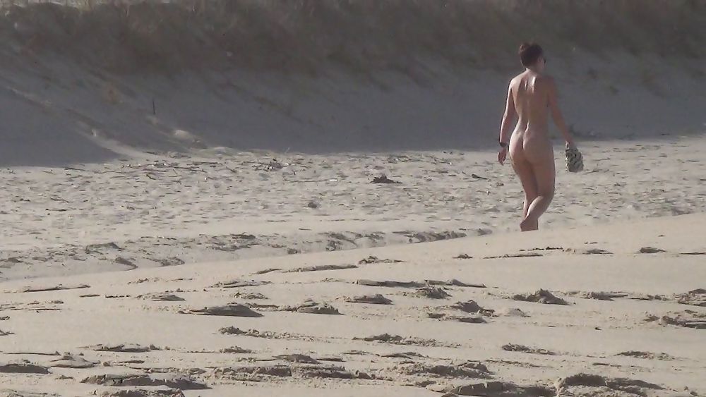 Nude girl walking on european beach #21831000