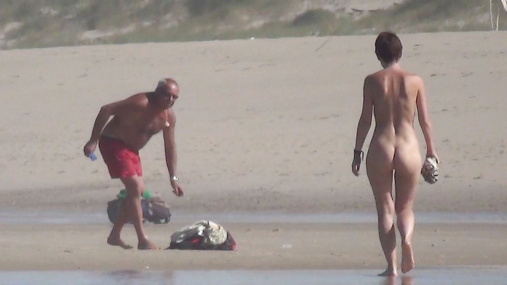 Nude girl walking on european beach #21831030