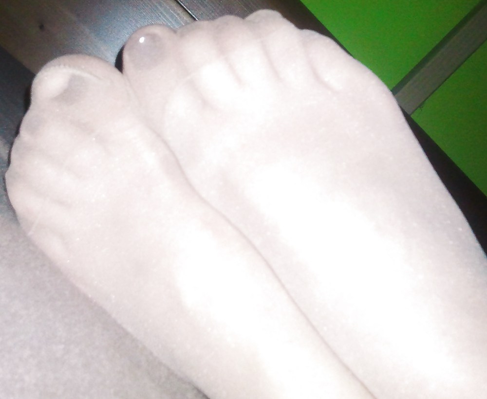 Nail polish feet in nylon pantyhose #19464237