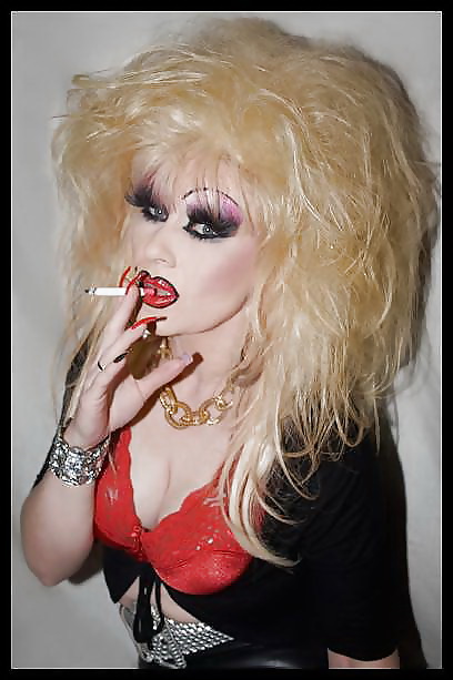 Smoking  glam transvestite with heavy make up #13904104