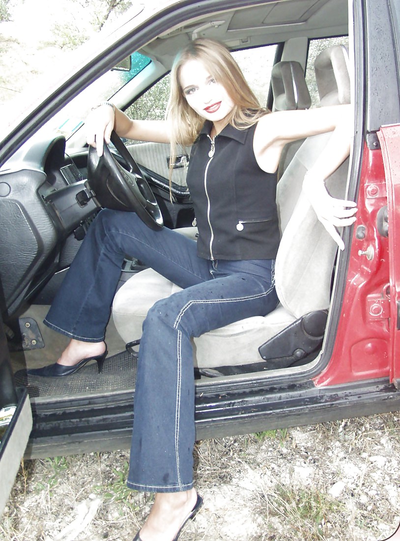 Blonde posing by her car #20688141