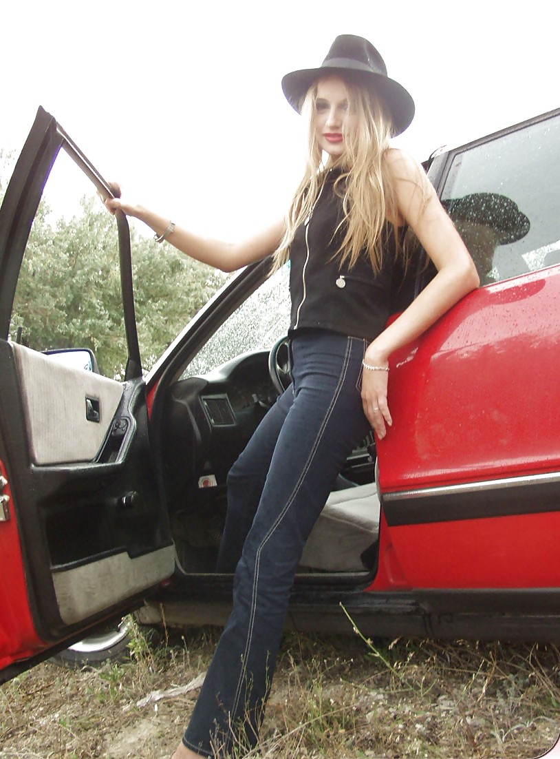 Blonde posing by her car #20688183