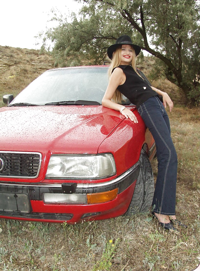 Blonde posing by her car #20688199