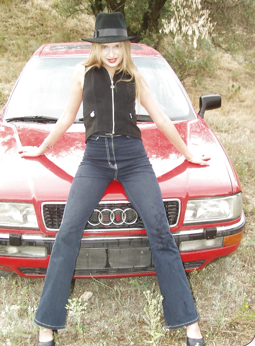 Blonde posing by her car #20688245