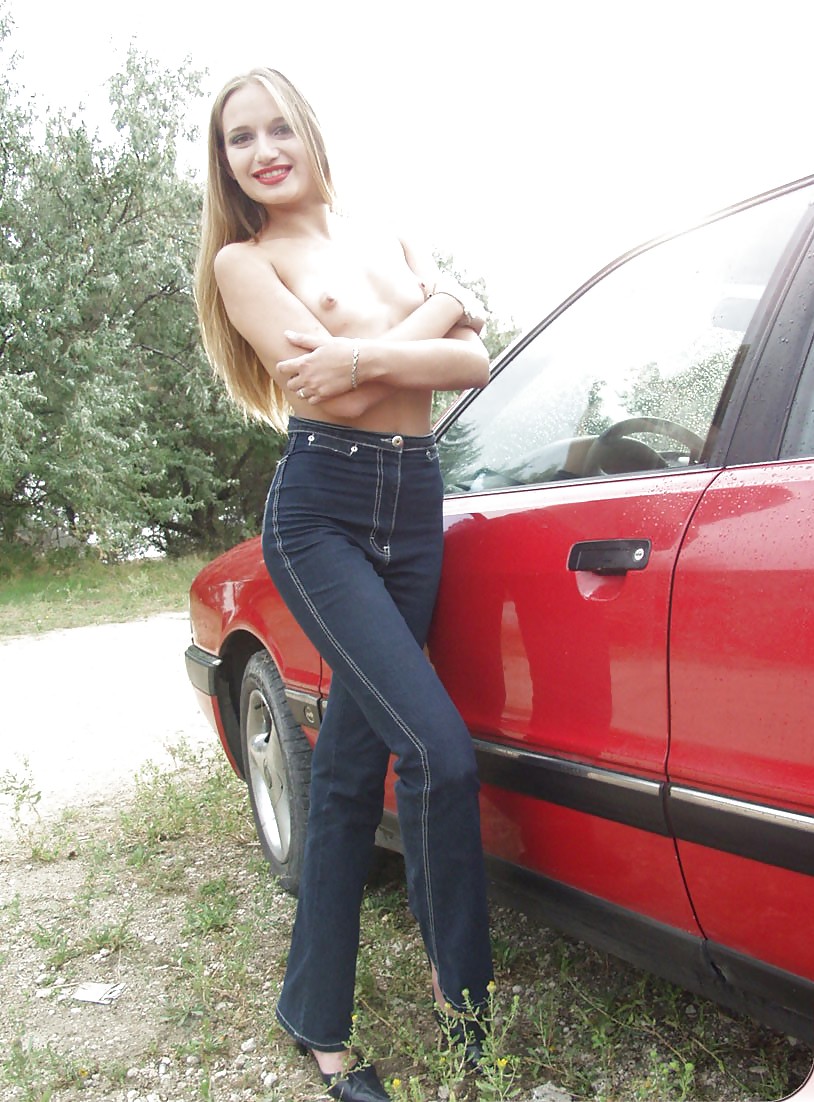 Blonde posing by her car #20688397