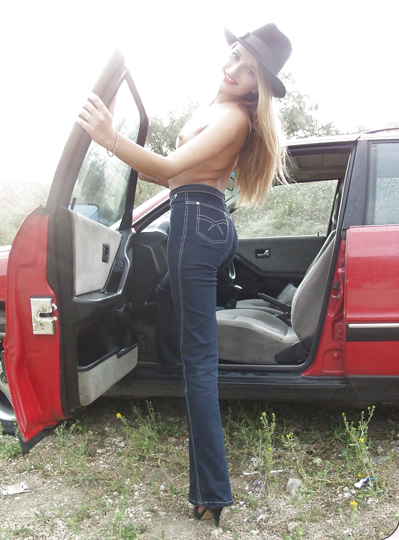 Blonde posing by her car #20688403