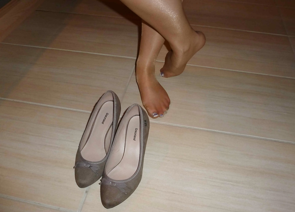 Nylons and shoes in the kitchen #18034141