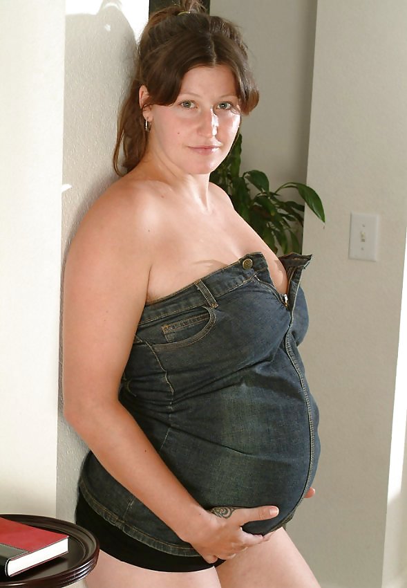 Busty pregnant brunette undressing #10613992