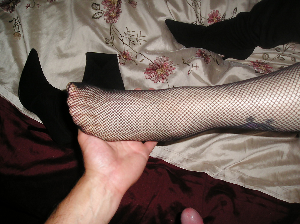 Natasha's arse and feet wearing fishnet stockings
