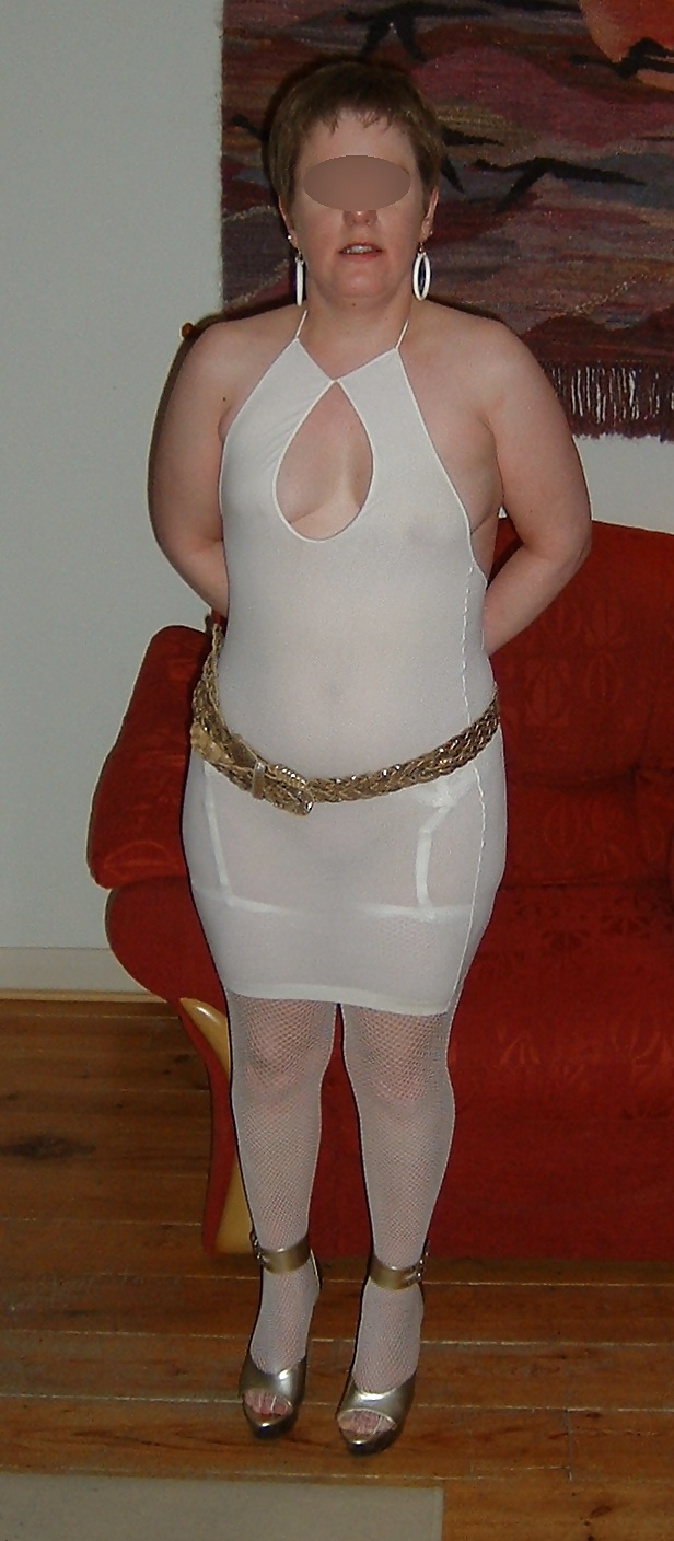 Transparent white dress and fishnet stockings