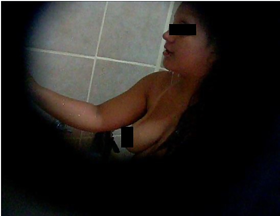 Young latina teen in the shower has beautiful tits