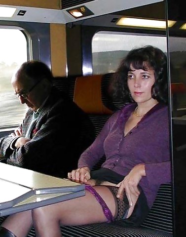 Women flashing stockings on public transport.  #39936899