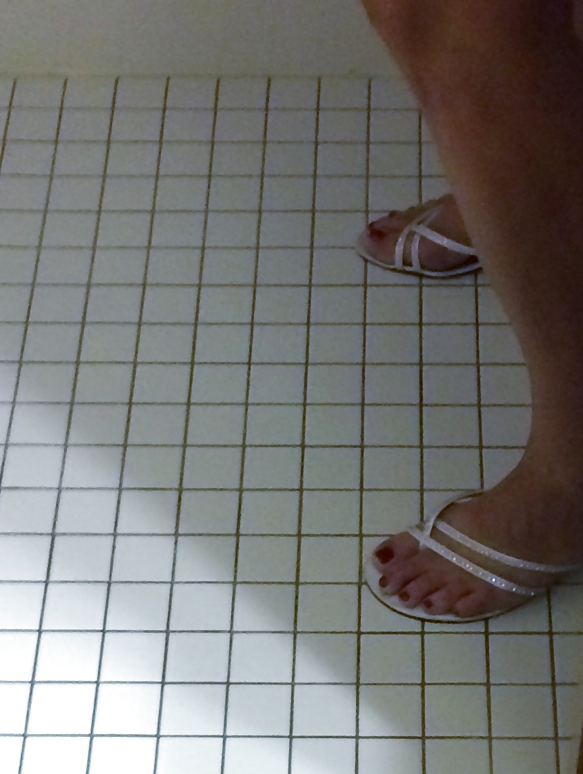 Wife's feet in strappy sandals