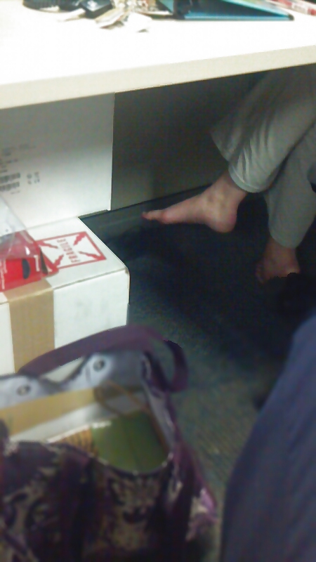 Coworker barefoot at desk #36135323