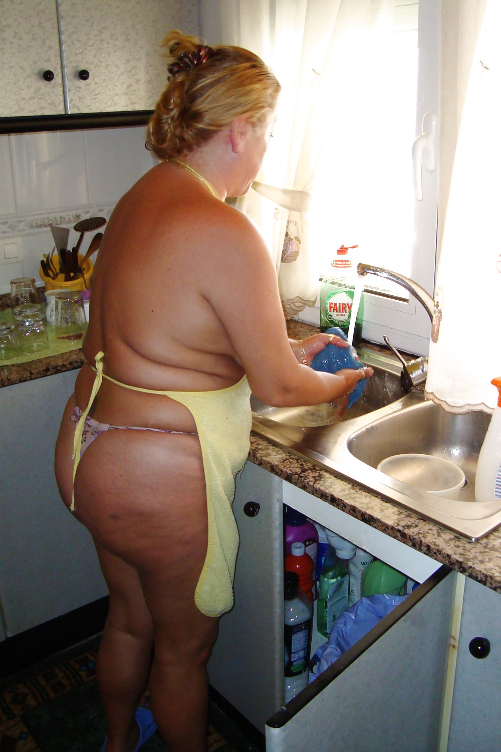 A beautiful mature woman in the kitchen #37053654