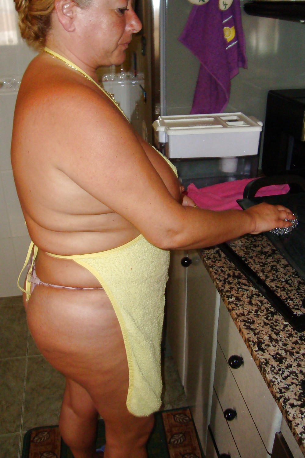 A beautiful mature woman in the kitchen #37053663