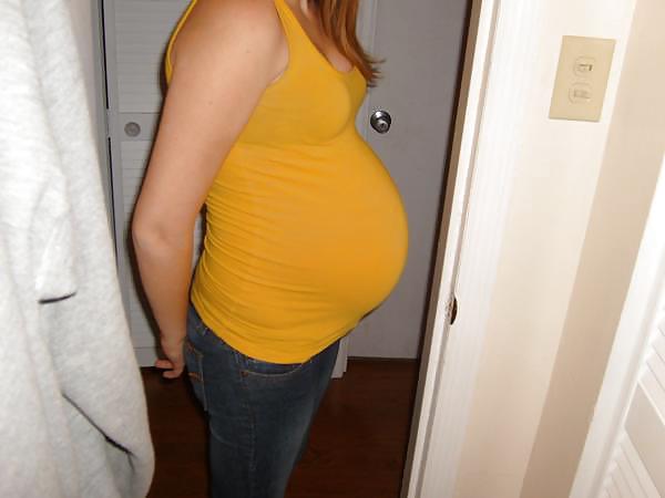 Big pregnant belly in tight clothes #33274474