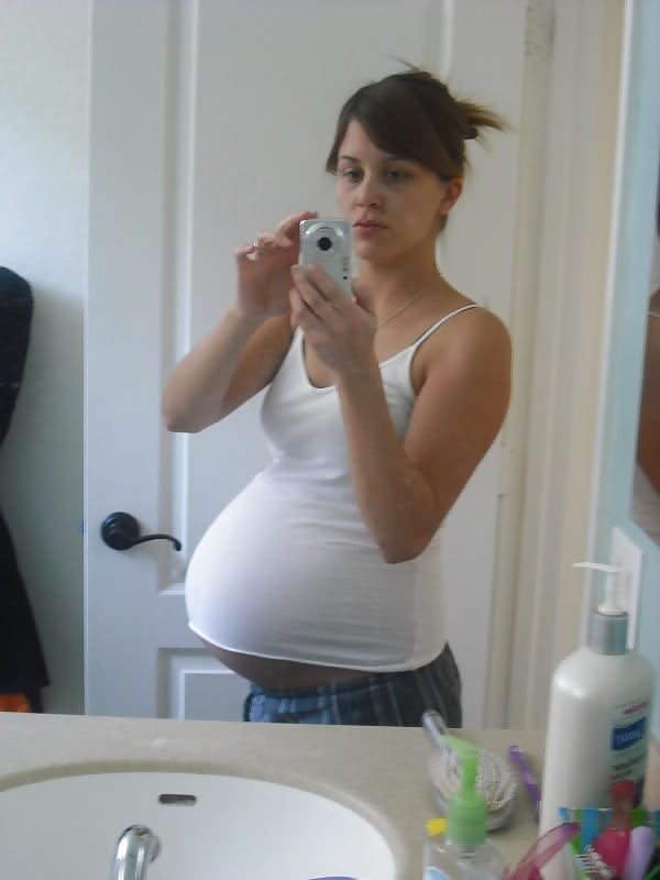 Big pregnant belly in tight clothes #33274486