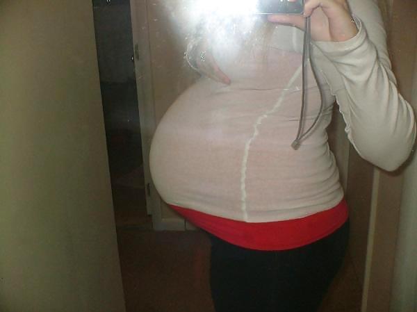 Big pregnant belly in tight clothes #33274490