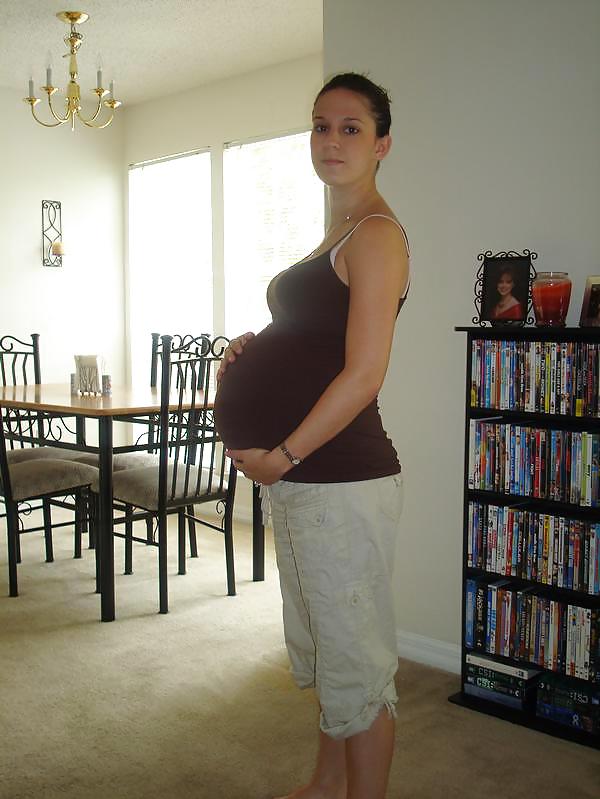 Big pregnant belly in tight clothes #33274494