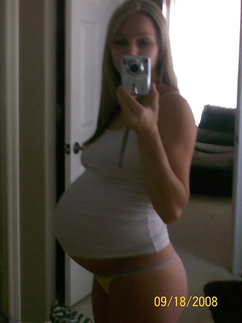 Big pregnant belly in tight clothes #33274495