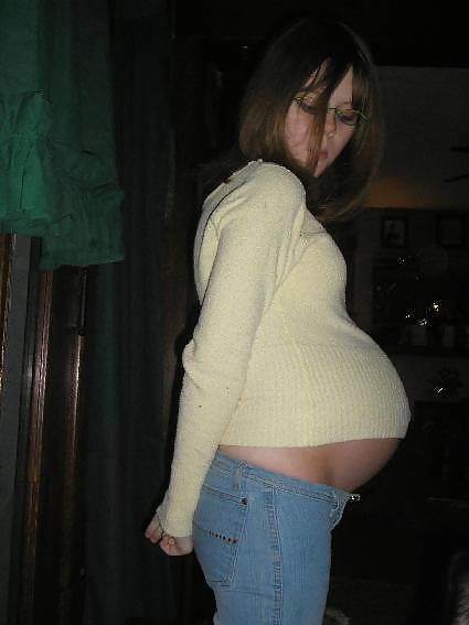 Big pregnant belly in tight clothes #33274508
