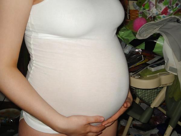 Big pregnant belly in tight clothes #33274513