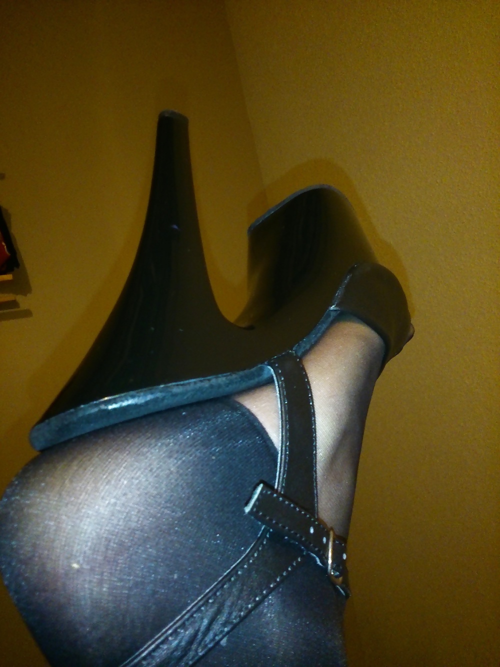 Feet In Black Stockings, Leather High Heels And Blue Polish #33374610