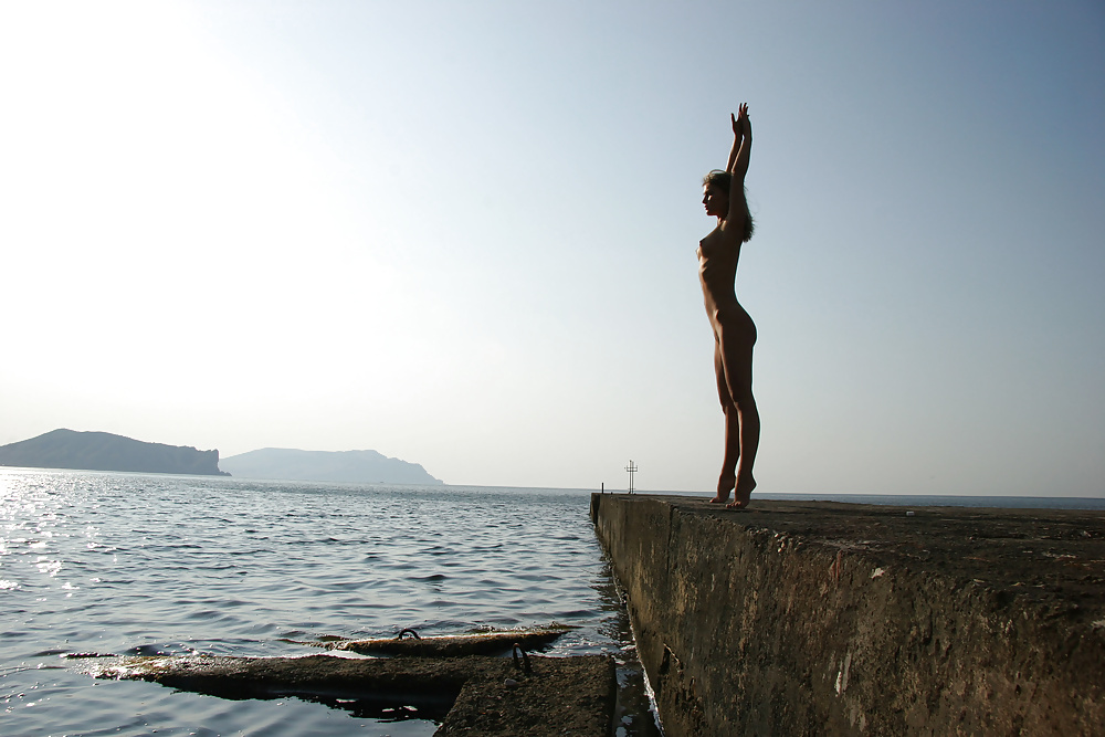 Versatile nudist at the pier.