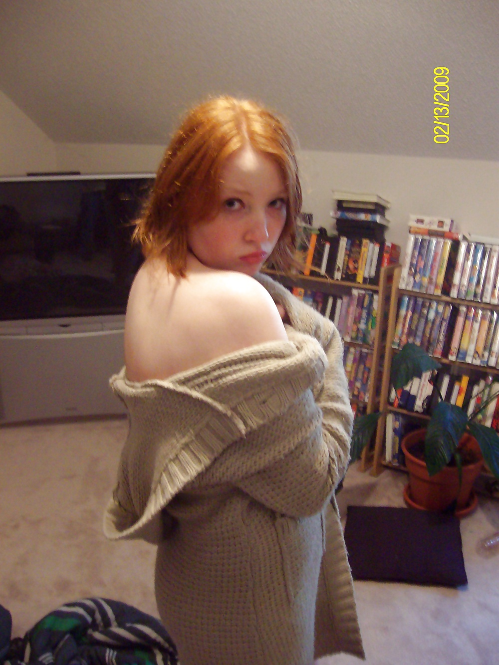 Cute Red Head Poses in her Messy Apartment  #33415898