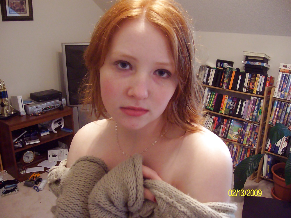 Cute Red Head Poses in her Messy Apartment  #33415903