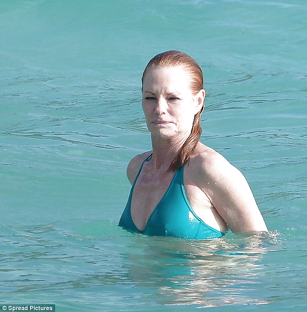 Beautiful Marg Helgenberger wearing green bikini. #28144135