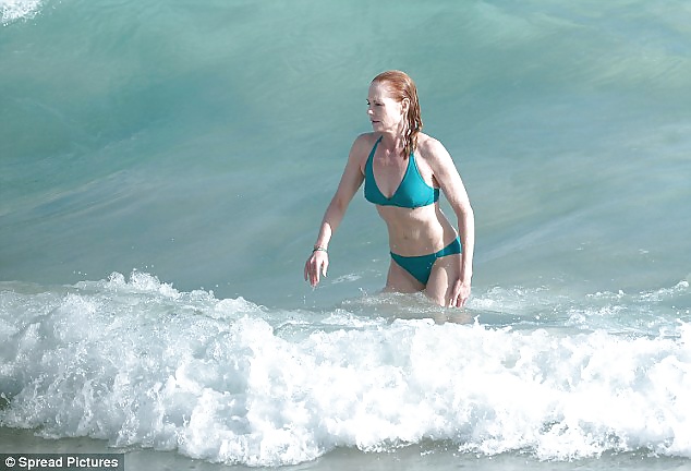 Beautiful Marg Helgenberger wearing green bikini. #28144151