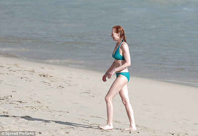 Beautiful Marg Helgenberger wearing green bikini. #28144159