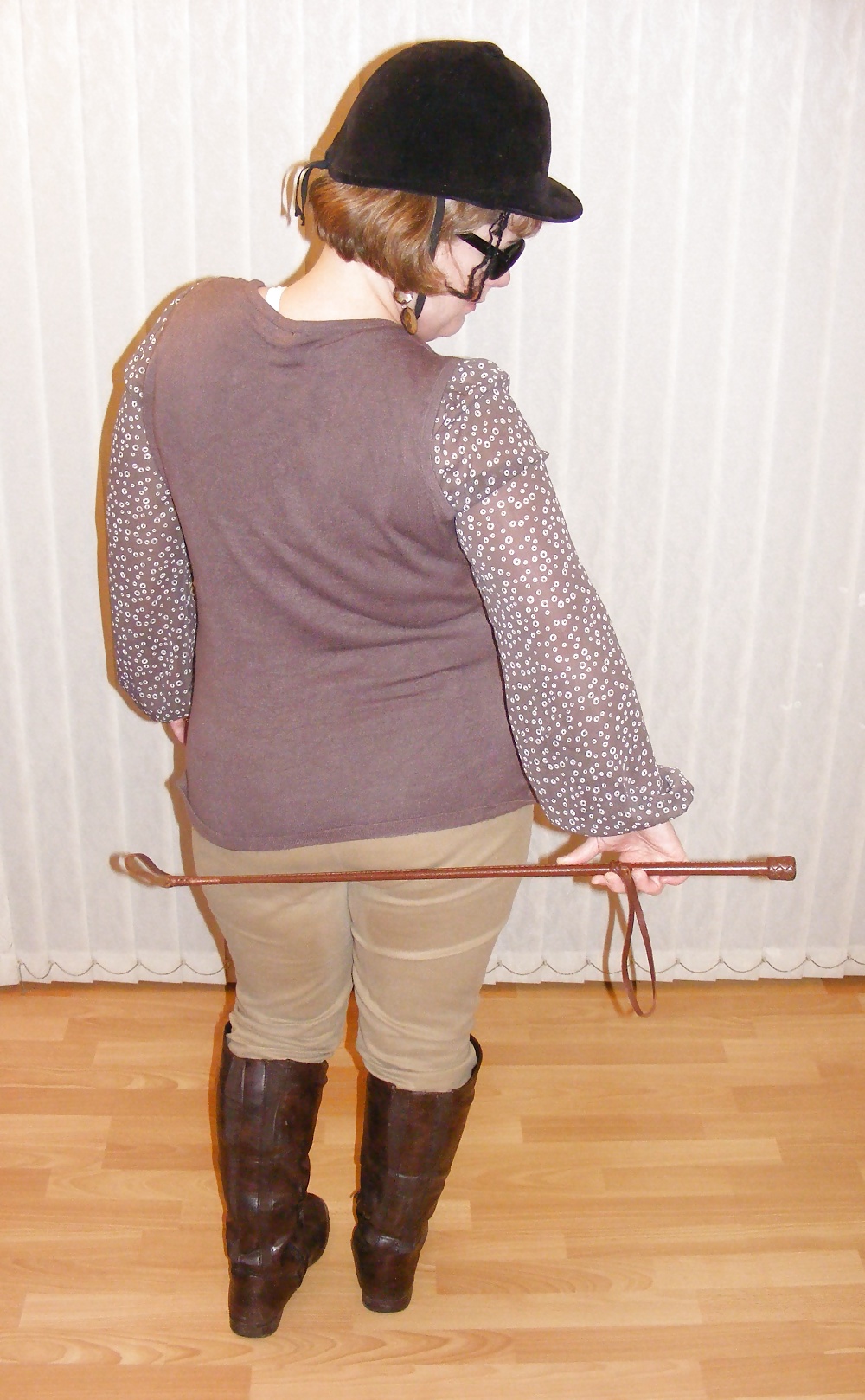 White knickers, boots, and riding crop #25226760