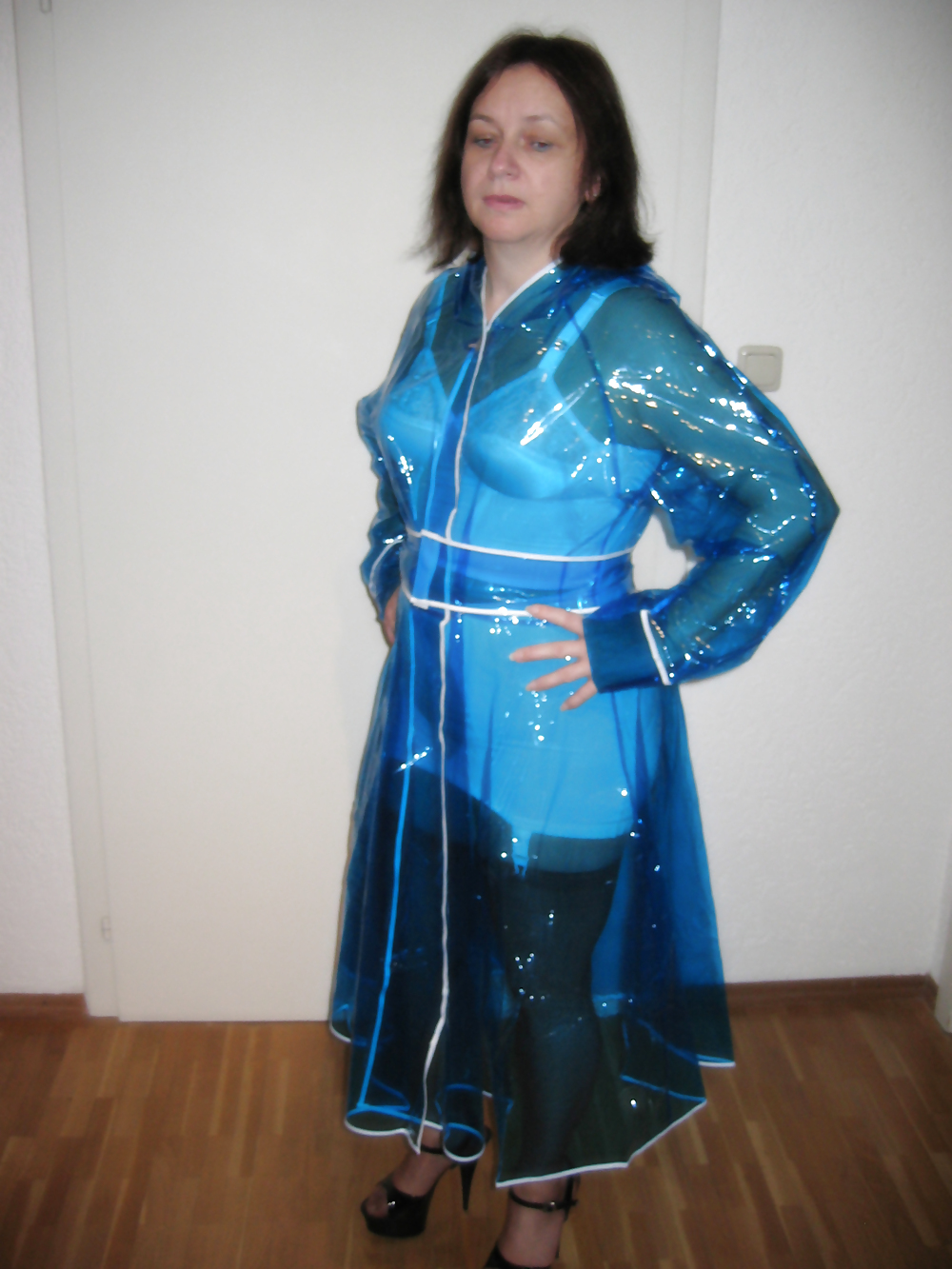 Wife in girdle and PVC Raincoat #36594633