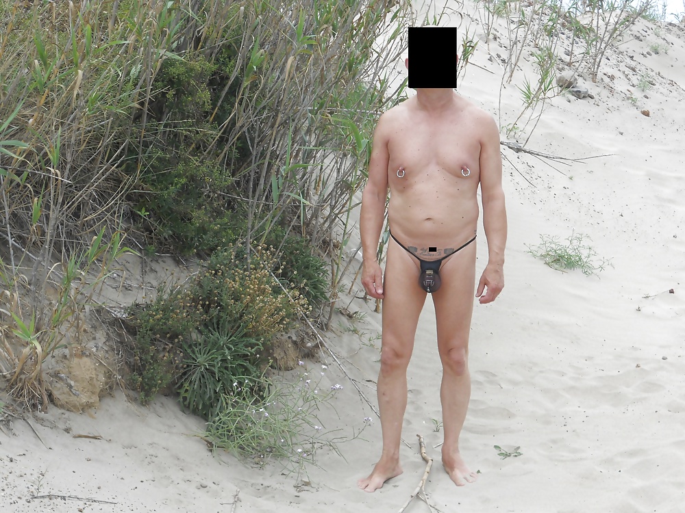 Slave in swimsuit , on the beach dressed #31345803