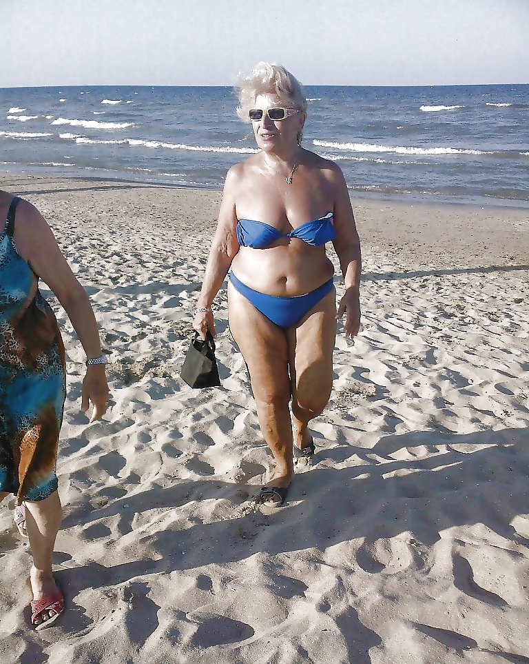 Beautiful mature women on the beach #26727524